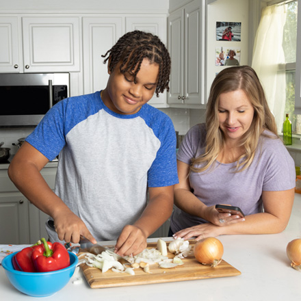 Mother and son prepping food for dinner