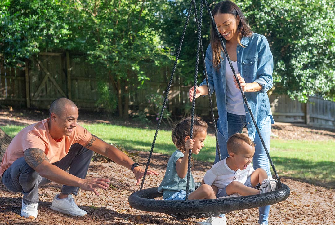 Family on a tire swing
